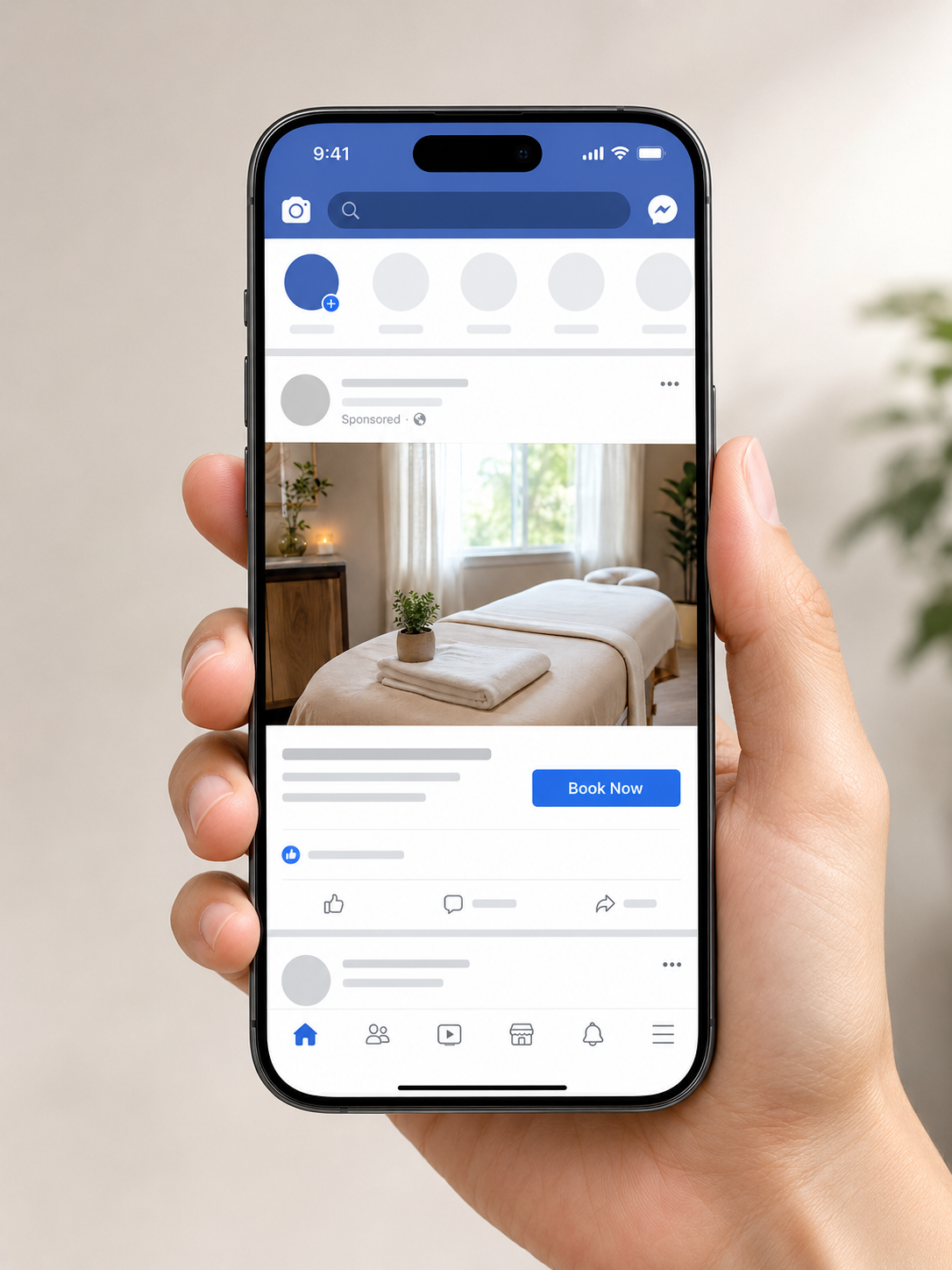 Example massage studio Facebook ad on a phone with a Book Now button